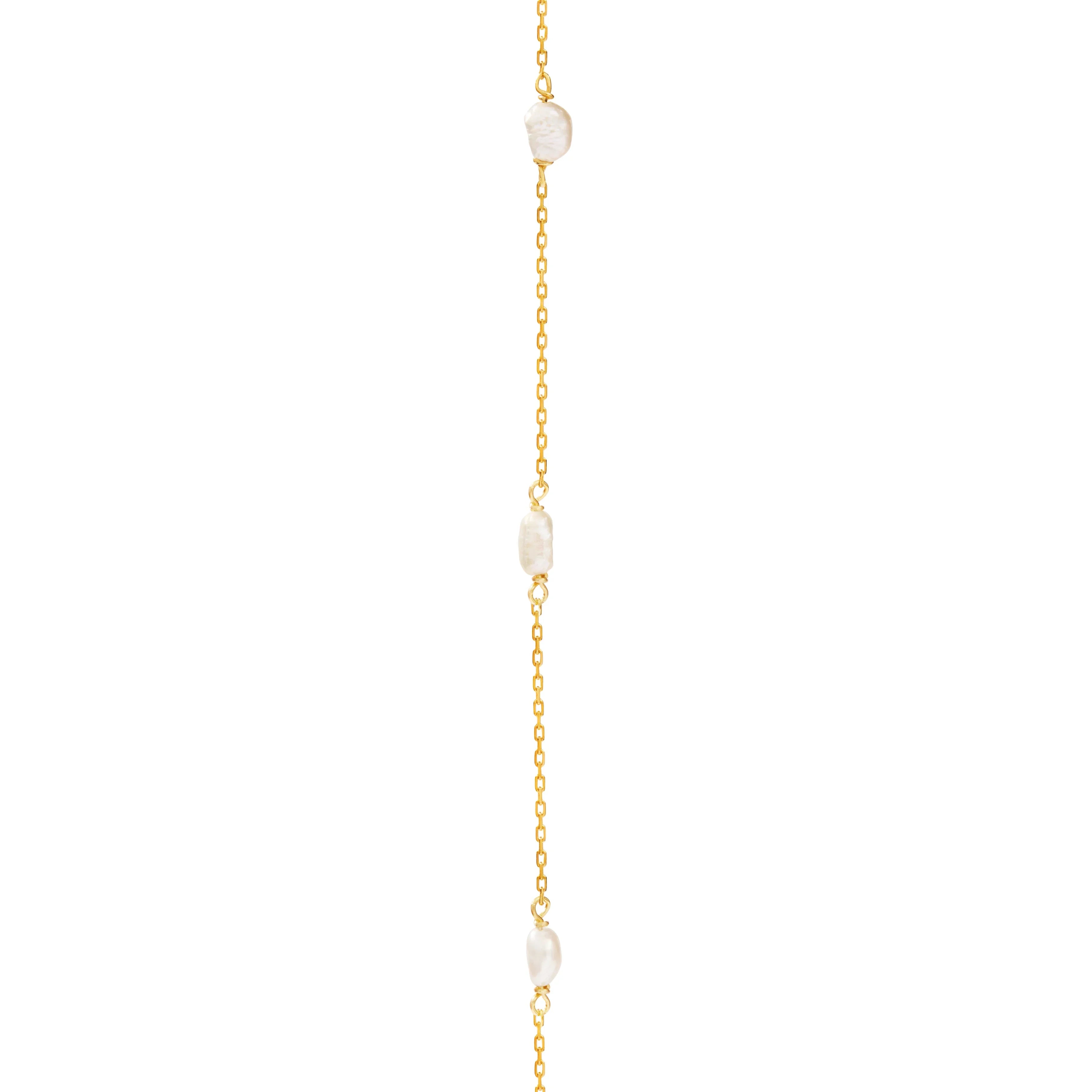 Delicate gold chain bracelet with irregular white pearls, minimalist fine jewelry